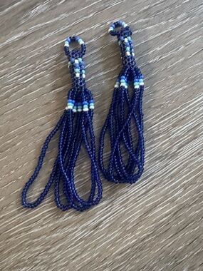 Beaded tassels constructed of blue and white small glass beads jewelry making